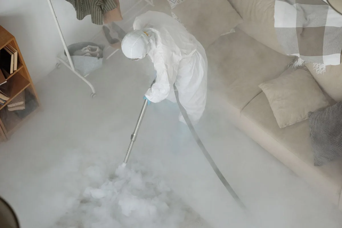 Biohazard cleanup technician in protective equipment, Westwood, KS
